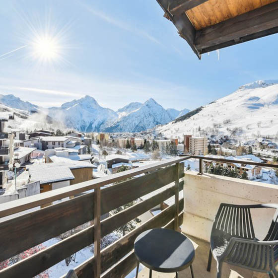 View over the snowy mountains from the balcony at Hotel Turan