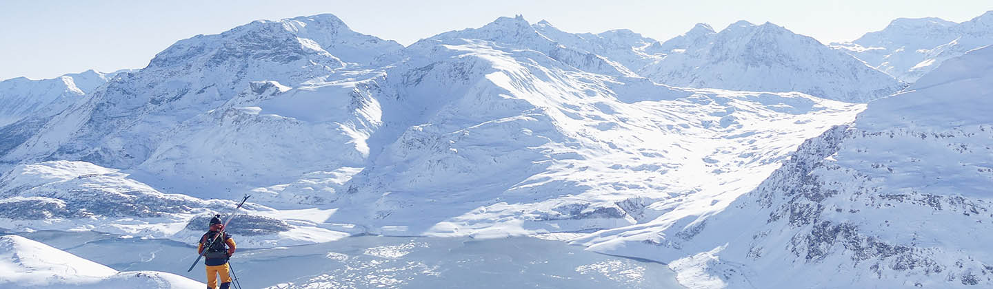 Man looking at the snoy mountains in Val Cenis