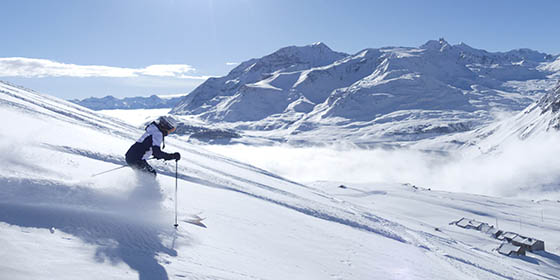 Woman skiing down the pistes in Val Cenis