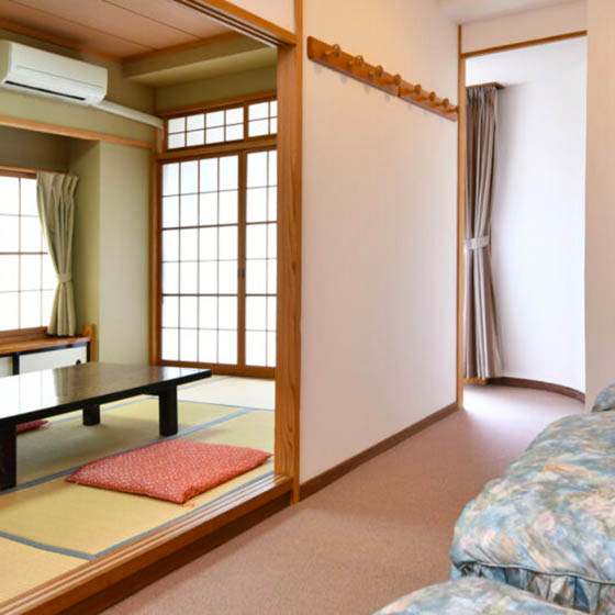 Bedroom at the Marukin Ryokan hotel in Happo Village, Japan